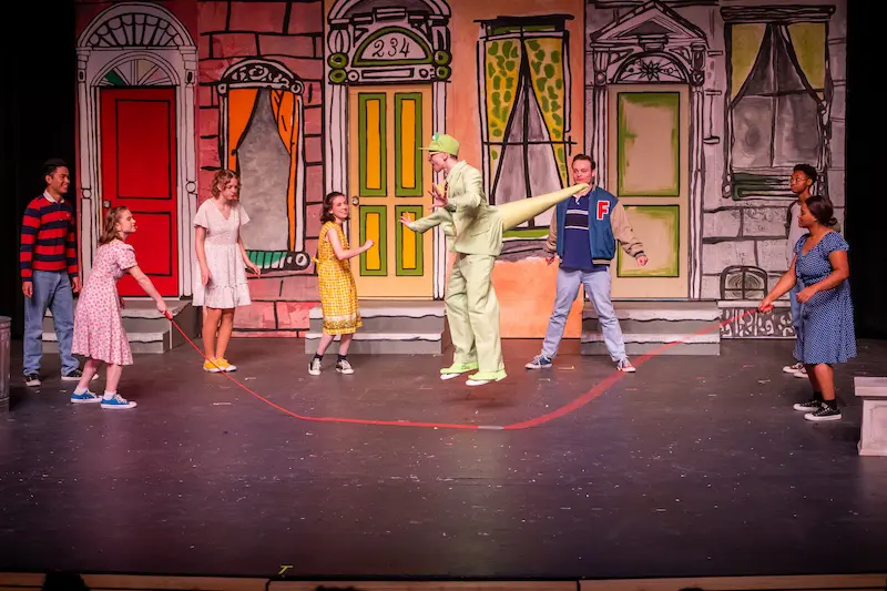 students on stage performing