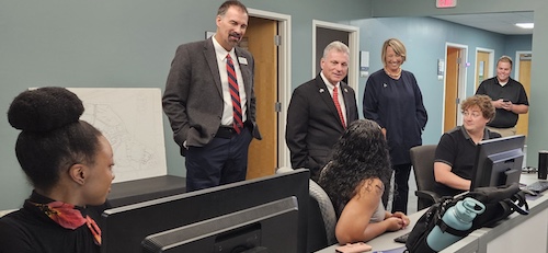 Dr. Rayfield, Patrick Aiken, Buddy Carter talking with students