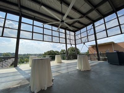 small circular tables next to a sunny view