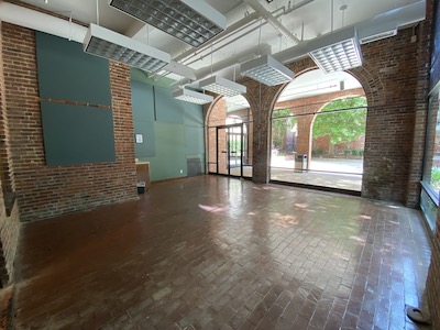 brightly lit hardwood room open to exterior