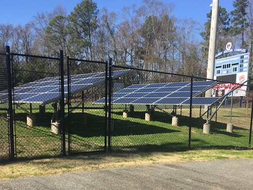 several solar panels on a field